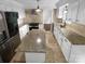 Bright kitchen featuring an island, granite countertops, stainless steel appliances, and modern finishes at 10518 Fairway Ridge Rd, Charlotte, NC 28277
