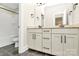 Bathroom showcasing double vanity, modern cabinets, and tiled floor at 11052 Preservation Park Dr, Charlotte, NC 28214
