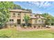 A beautiful front exterior featuring manicured landscaping and a walkway to the front door at 11052 Preservation Park Dr, Charlotte, NC 28214