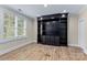 Cozy home office with custom built-in shelving, hardwood floors, and natural light at 11052 Preservation Park Dr, Charlotte, NC 28214
