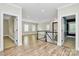Upstairs landing with hardwood floors leading to various parts of the home at 11052 Preservation Park Dr, Charlotte, NC 28214