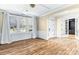 Elegant living room featuring wood floors, decorative molding, and an arched doorway at 11052 Preservation Park Dr, Charlotte, NC 28214