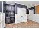 Living room features custom built-ins, hardwood floors, and neutral paint at 11052 Preservation Park Dr, Charlotte, NC 28214