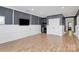 Living room featuring hardwood floors, custom built-ins, and neutral paint at 11052 Preservation Park Dr, Charlotte, NC 28214