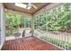 Relaxing screened porch featuring a wood floor, a ceiling fan and lights, and a view of a lush backyard at 11052 Preservation Park Dr, Charlotte, NC 28214