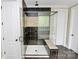 Beautiful tiled shower with glass enclosure, bench, and decorative tile accent at 11052 Preservation Park Dr, Charlotte, NC 28214