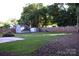 The backyard features two storage sheds, a dog house, and a tall wooden fence at 1109 Edwards St, Rock Hill, SC 29732
