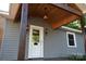 Close-up of the covered front porch, featuring stylish light fixtures and a glass-paneled front door at 1109 Edwards St, Rock Hill, SC 29732