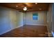 Bright living room with hardwood floors, a ceiling fan, and ample natural light at 1109 Edwards St, Rock Hill, SC 29732
