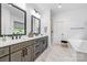 Bright bathroom with dual vanities, granite countertops and a separate bathtub at 1149 Rosecliff Dr, Waxhaw, NC 28173