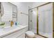 Modern bathroom features a marble-tiled shower with gold hardware and a sleek vanity at 1149 Rosecliff Dr, Waxhaw, NC 28173