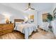 Bright and airy bedroom with hardwood floors, large windows, and a ceiling fan at 1149 Rosecliff Dr, Waxhaw, NC 28173
