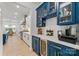 Stylish butler's pantry featuring custom blue cabinets, wine storage, and quartz countertops at 1149 Rosecliff Dr, Waxhaw, NC 28173
