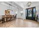 Bright dining room with coffered ceilings, wainscoting, and an elegant chandelier at 1149 Rosecliff Dr, Waxhaw, NC 28173