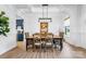Charming dining room featuring wainscoting, modern lighting, and a large window at 1149 Rosecliff Dr, Waxhaw, NC 28173