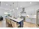 Beautiful eat-in kitchen features an island, stainless steel appliances, and pendant lighting at 1149 Rosecliff Dr, Waxhaw, NC 28173