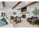 Inviting living room with a brick fireplace, wooden beams, and comfortable seating at 1149 Rosecliff Dr, Waxhaw, NC 28173