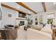 Comfortable living room with a fireplace, wooden beams, and lots of natural light at 1149 Rosecliff Dr, Waxhaw, NC 28173