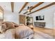 Spacious main bedroom featuring exposed wood beams and an ensuite bathroom at 1149 Rosecliff Dr, Waxhaw, NC 28173