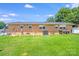 Green backyard featuring a swing set and mature trees at 1204 N 12Th St, Bessemer City, NC 28016