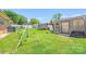 Expansive backyard with a swing set, trampoline and storage building at 1204 N 12Th St, Bessemer City, NC 28016