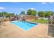 Backyard pool features a well-maintained lawn and perimeter fencing at 1204 N 12Th St, Bessemer City, NC 28016