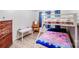 bedroom featuring bunk beds, a wooden dresser, and a small desk setup at 1204 N 12Th St, Bessemer City, NC 28016