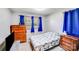 Bedroom showcasing wooden dressers, natural lighting, and a comfortable sleeping area at 1204 N 12Th St, Bessemer City, NC 28016