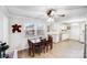 Bright dining area featuring a dark wood table, ceiling fan, and ample natural light at 1204 N 12Th St, Bessemer City, NC 28016