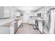 Bright and modern kitchen featuring white cabinets, updated appliances, and ample counter space at 1204 N 12Th St, Bessemer City, NC 28016