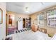 Bright kitchen with white appliances, tile flooring, and adjacent laundry room at 1204 N 12Th St, Bessemer City, NC 28016
