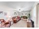 Cozy living room with a brick fireplace, plush seating, and ample natural light at 1204 N 12Th St, Bessemer City, NC 28016