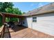 Inviting covered back deck featuring wood flooring, comfortable seating, and space for outdoor dining and relaxation at 1276 Beechwood Dr, Newton, NC 28658