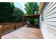 View of wooden deck featuring seating, a rocking chair, and a grill under covered pergola at 1276 Beechwood Dr, Newton, NC 28658