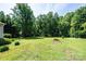 Lush backyard with mature trees at 1276 Beechwood Dr, Newton, NC 28658