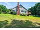 Exterior of house featuring a brick chimney and second story deck at 1276 Beechwood Dr, Newton, NC 28658