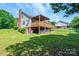 Exterior view showcasing backyard deck and fenced yard at 1276 Beechwood Dr, Newton, NC 28658