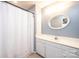 Bathroom featuring a shower/tub combo, vanity and oval mirror at 1276 Beechwood Dr, Newton, NC 28658
