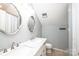 Bathroom featuring double sinks, vanity, and shower/tub combo at 1276 Beechwood Dr, Newton, NC 28658