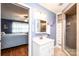 Bright bathroom featuring a modern vanity, shower, and bedroom in view at 1276 Beechwood Dr, Newton, NC 28658