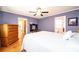 Cozy bedroom featuring a wooden dresser, hardwood floors, and a comfortable bed at 1276 Beechwood Dr, Newton, NC 28658