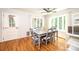 Bright dining room with hardwood floors, a large table with seating, and ample natural light, perfect for gatherings at 1276 Beechwood Dr, Newton, NC 28658