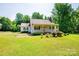 Charming single-story home with a well-manicured lawn and a covered front porch at 1276 Beechwood Dr, Newton, NC 28658