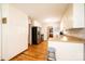 Bright kitchen with stainless steel appliances, light countertops, hardwood floors, and breakfast stool at 1276 Beechwood Dr, Newton, NC 28658