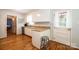 Well lit kitchen with stainless steel appliances and hardwood floors; kitchen open to additional room at 1276 Beechwood Dr, Newton, NC 28658