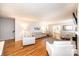 Open-concept living room boasting hardwood floors, comfortable seating, and natural light, creating a welcoming space at 1276 Beechwood Dr, Newton, NC 28658