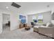 Comfortable bonus room with a couch, TV, and desk, perfect for relaxation or work at 15023 Longmoore Dr, Charlotte, NC 28278