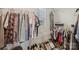 Walk in closet with hanging clothes, and shoes organized on the floor at 15023 Longmoore Dr, Charlotte, NC 28278