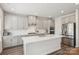 Modern kitchen with stainless steel appliances, white countertops, and hardwood floors at 15023 Longmoore Dr, Charlotte, NC 28278