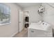 Laundry room featuring white washer and dryer, neutral walls, and a closet area at 15023 Longmoore Dr, Charlotte, NC 28278